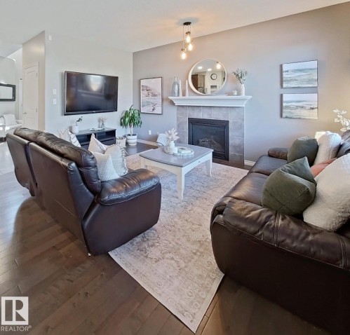 4006 Charles Place Sw, Edmonton, AB - Indoor Photo Showing Living Room With Fireplace