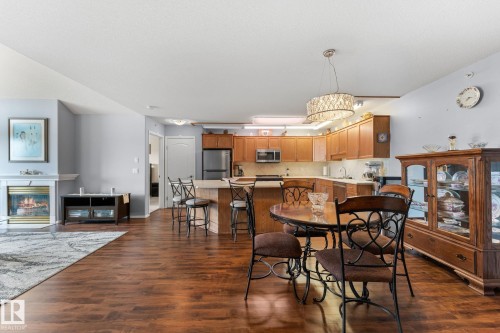 #306 6623 172 St Nw, Edmonton, AB - Indoor Photo Showing Dining Room With Fireplace