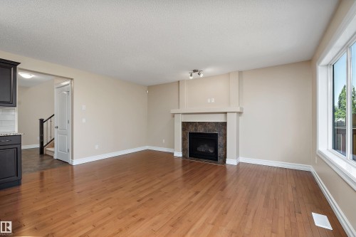 17330 8A Avenue Sw, Edmonton, AB - Indoor Photo Showing Living Room With Fireplace