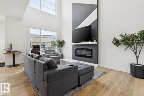 211 Kettyl Court, Leduc, AB - Indoor Photo Showing Living Room With Fireplace