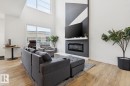 211 Kettyl Court, Leduc, AB  - Indoor Photo Showing Living Room With Fireplace 