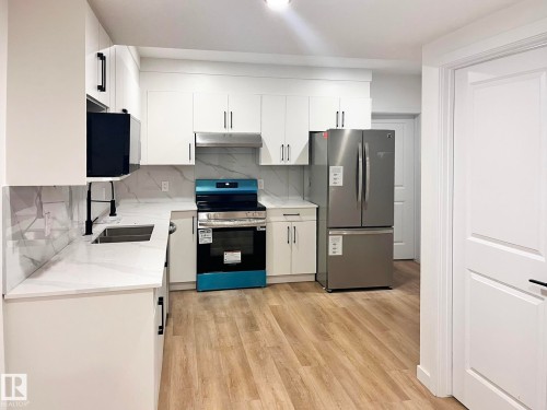 211 Kettyl Court, Leduc, AB - Indoor Photo Showing Kitchen With Double Sink
