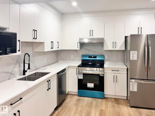 211 Kettyl Court, Leduc, AB - Indoor Photo Showing Kitchen With Double Sink