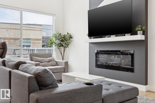 211 Kettyl Court, Leduc, AB - Indoor Photo Showing Living Room With Fireplace