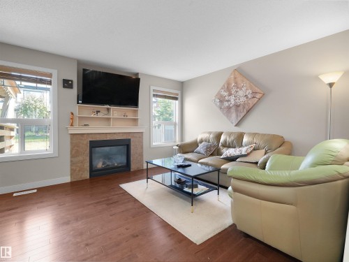 1692 Cunningham Way, Edmonton, AB - Indoor Photo Showing Living Room With Fireplace