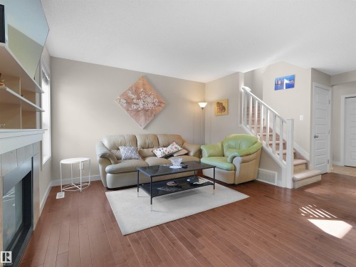 1692 Cunningham Way, Edmonton, AB - Indoor Photo Showing Living Room With Fireplace