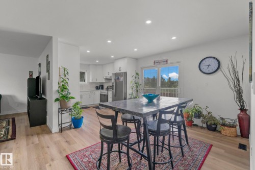 Open-concept living space featuring wood-finish flooring, recessed lighting, and white walls - 4119 18 Avenue Nw, Edmonton, AB - Indoor Photo Showing Dining Room