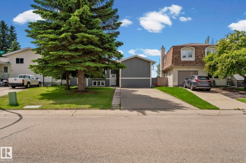 Two single-family residences with established front landscaping and paved driveways - 4119 18 Avenue Nw, Edmonton, AB - Outdoor With Facade