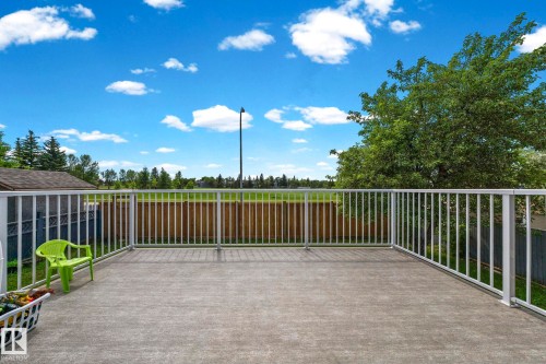 Expansive concrete deck featuring full white railing surround - 4119 18 Avenue Nw, Edmonton, AB - Outdoor