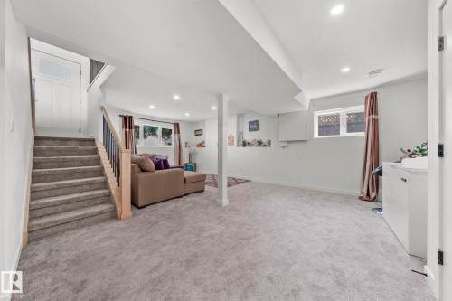 Lower level featuring light gray carpeting, recessed lighting, and white painted walls - 4119 18 Avenue Nw, Edmonton, AB - Indoor