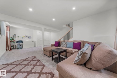 Open-concept room featuring light gray carpeting, recessed lighting, and white walls - 4119 18 Avenue Nw, Edmonton, AB - Indoor Photo Showing Living Room