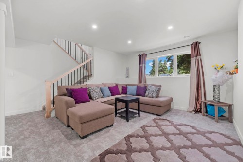 Spacious finished lower level featuring recessed lighting, a multi-pane window, and carpet flooring - 4119 18 Avenue Nw, Edmonton, AB - Indoor Photo Showing Living Room