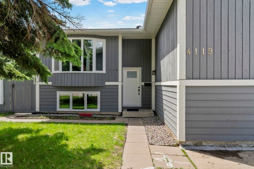 Gray siding exterior with white trim accents - 4119 18 Avenue Nw, Edmonton, AB - Outdoor
