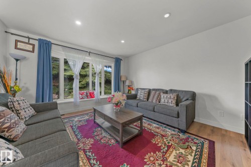 Living space featuring a prominent bay window, recessed lighting, and wood-finish flooring - 4119 18 Avenue Nw, Edmonton, AB - Indoor Photo Showing Living Room
