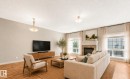 Photo has been virtually staged - #16 7293 South Terwillegar Dr Nw, Edmonton, AB  - Indoor Photo Showing Living Room With Fireplace 