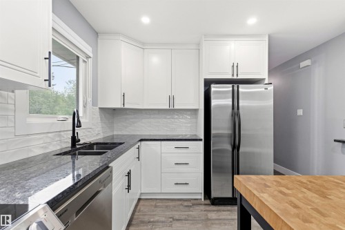7924 89 Avenue Nw, Edmonton, AB - Indoor Photo Showing Kitchen With Stainless Steel Kitchen With Double Sink With Upgraded Kitchen