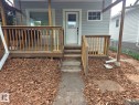Front exterior featuring light gray siding - 10656 93 Street, Edmonton, AB 