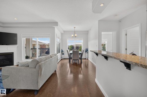 #465 11517 Ellerslie Rd Sw, Edmonton, AB - Indoor Photo Showing Living Room With Fireplace