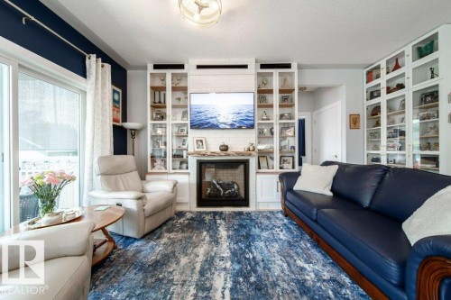 8731 85 Avenue Nw, Edmonton, AB - Indoor Photo Showing Living Room With Fireplace