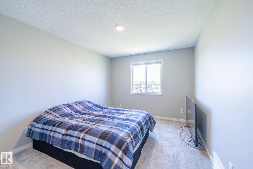 Windowed room featuring light gray walls, white trim, recessed lighting, and carpet flooring - 5403 Lark Landing Nw, Edmonton, AB - Indoor Photo Showing Bedroom