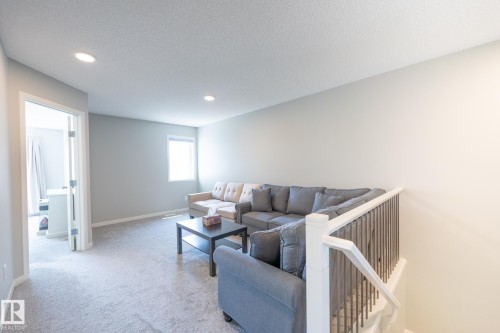 Carpeted recreational room with recessed lighting and a single window - 5403 Lark Landing Nw, Edmonton, AB - Indoor