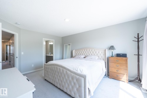 Carpeted bedroom featuring light gray wall paint and recessed lighting - 5403 Lark Landing Nw, Edmonton, AB - Indoor Photo Showing Bedroom