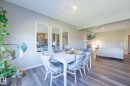 Spacious dining area featuring wood-finish flooring and recessed lighting - 5403 Lark Landing Nw, Edmonton, AB  - Indoor Photo Showing Dining Room 