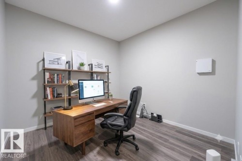 Light gray walls complement wood-finish flooring - 5403 Lark Landing Nw, Edmonton, AB - Indoor Photo Showing Office