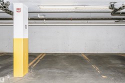 Designated parking space with concrete flooring - 