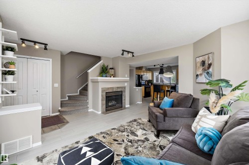 7214 19A Avenue Sw, Edmonton, AB - Indoor Photo Showing Living Room With Fireplace