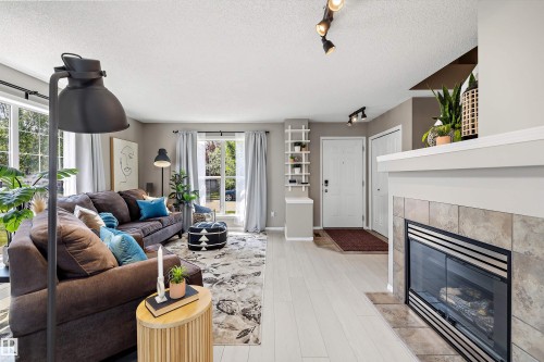 7214 19A Avenue Sw, Edmonton, AB - Indoor Photo Showing Living Room With Fireplace