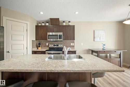 1715 Cunningham Way Sw, Edmonton, AB - Indoor Photo Showing Kitchen With Stainless Steel Kitchen With Double Sink With Upgraded Kitchen
