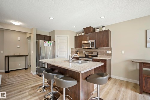 1715 Cunningham Way Sw, Edmonton, AB - Indoor Photo Showing Kitchen With Stainless Steel Kitchen With Double Sink With Upgraded Kitchen