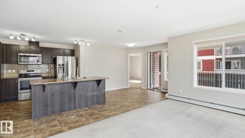 #229 1820 Rutherford Rd Sw, Edmonton, AB - Indoor Photo Showing Kitchen With Upgraded Kitchen