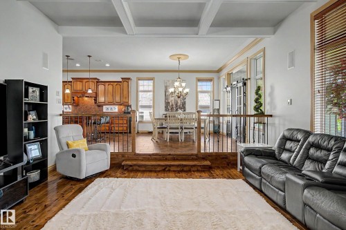 Living area featuring wood-finish flooring and coffered ceilings - 38 Longview Point(E), Spruce Grove, AB - Indoor Photo Showing Living Room