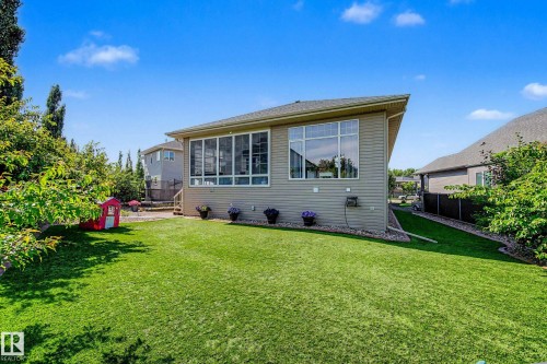 Expansive green lawn with mature perimeter trees - 38 Longview Point(E), Spruce Grove, AB - Outdoor