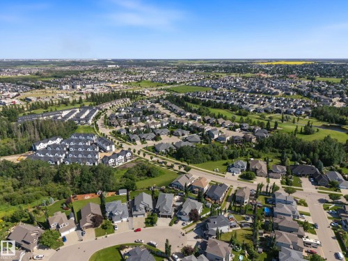 Expansive aerial view of a residential community featuring diverse housing styles, including single-family homes and multi-unit residences - 38 Longview Point(E), Spruce Grove, AB - Outdoor With View