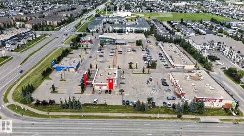 Commercial plaza featuring multiple retail buildings with ample surface parking - 833 Mcallister Crescent Sw, Edmonton, AB - Outdoor With View