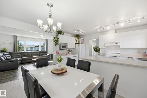 Open-concept living space featuring a dining area, kitchen, and living room - 15111 67 Street Nw, Edmonton, AB - Indoor