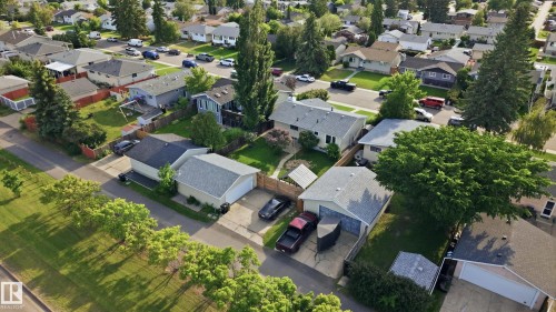 Residential neighborhood showcasing single-family homes with pitched roofs and mature landscaping - 15111 67 Street Nw, Edmonton, AB - Outdoor With View