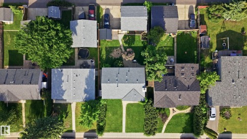 Aerial perspective showcasing a residential area with varied home styles and well-maintained lawns - 15111 67 Street Nw, Edmonton, AB - Outdoor