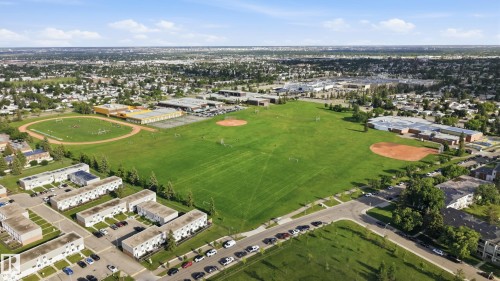Expansive green space featuring multiple sports fields, including a baseball diamond and track - 15111 67 Street Nw, Edmonton, AB - Outdoor With View