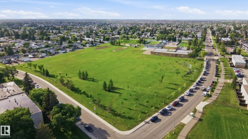 Expansive green space bordered by residential areas and roadways - 15111 67 Street Nw, Edmonton, AB - Outdoor With View