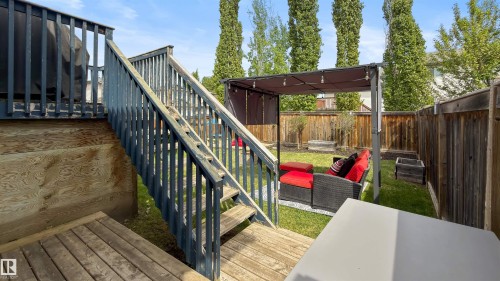 Multi-level wooden deck with staircase and railings - 679 Kananaskis Drive, Devon, AB - Outdoor With Deck Patio Veranda With Exterior
