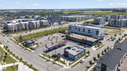 Aerial perspective showcasing commercial and residential buildings - 319 Desrochers Boulevard Sw, Edmonton, AB - Outdoor With View