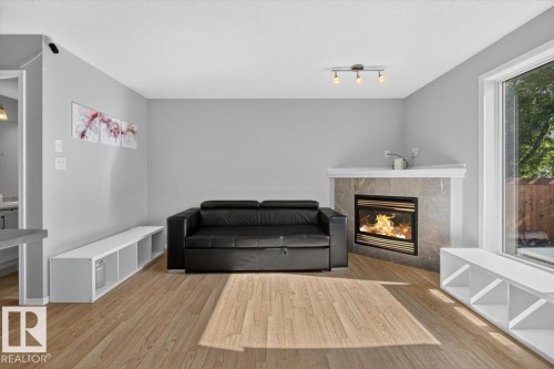 Sitting room - #18 345 Kirkness Rd Nw, Edmonton, AB - Indoor Photo Showing Living Room With Fireplace