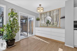 Sliding glass patio door with wood-finish flooring - 
