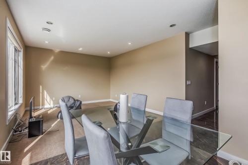 Open-concept living space featuring recessed lighting and a large window - 4104 8 Street Nw, Edmonton, AB - Indoor Photo Showing Office