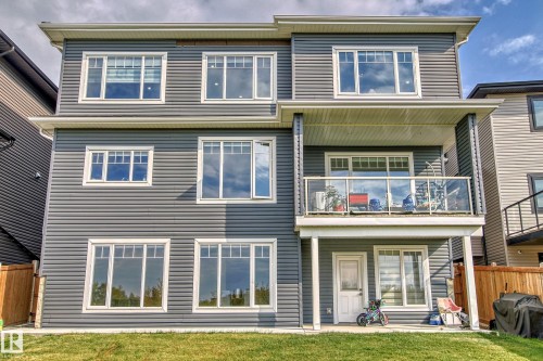 Three-story exterior featuring horizontal siding - 4104 8 Street Nw, Edmonton, AB - Outdoor