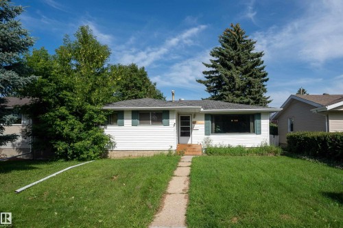 Single-story residence featuring white siding and a contrasting dark roof - 5307 105 Street Nw, Edmonton, AB - Outdoor With Facade